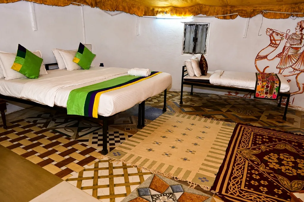 Authentic cottage bedroom interior with handcrafted bedding and clay walls