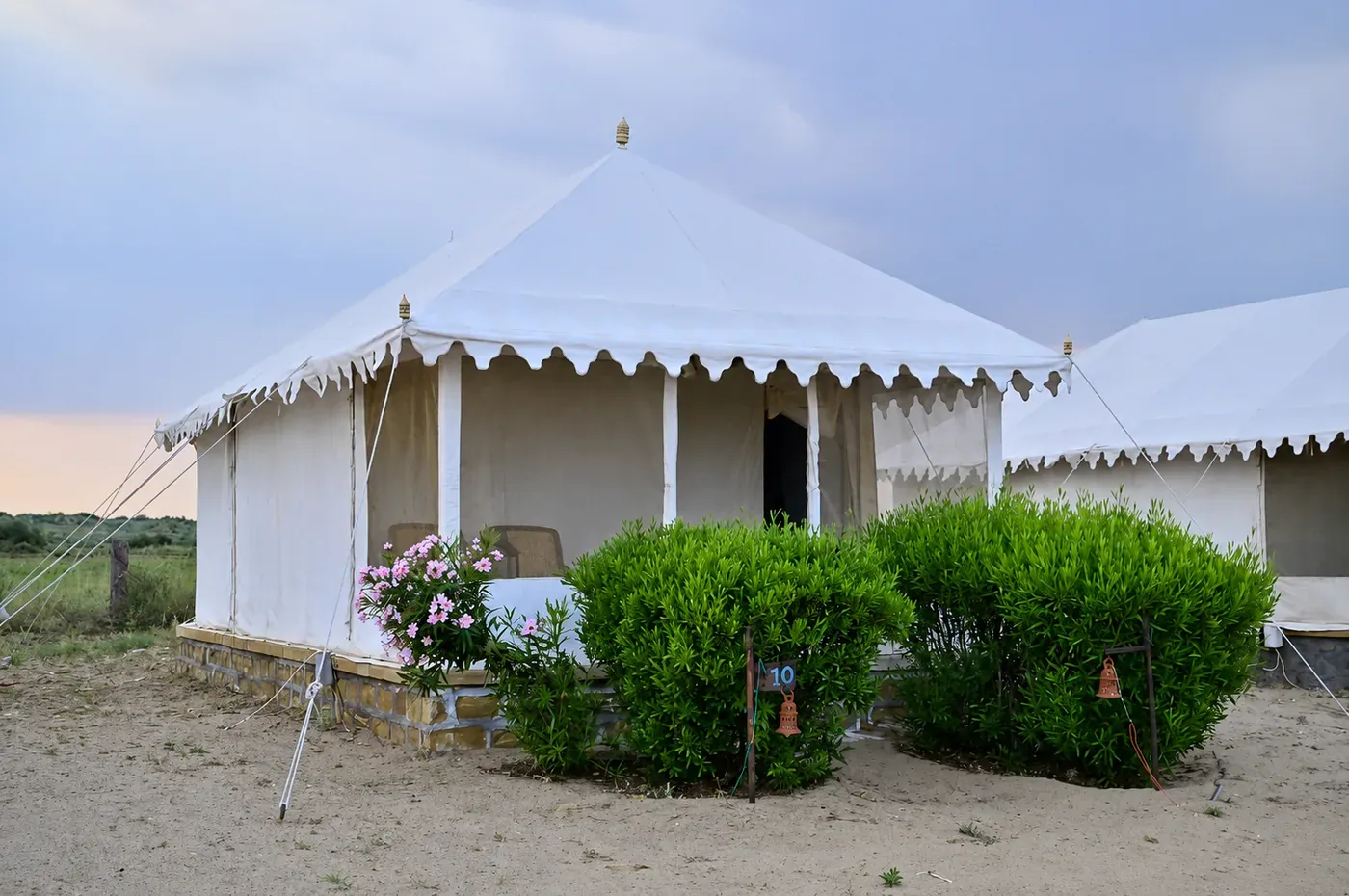 Camel safari caravan riding along the ridge of Khuri sand dunes