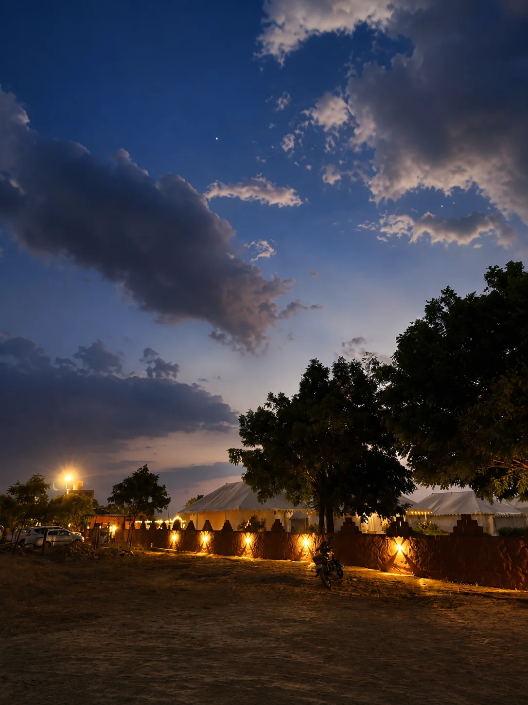 Travelers enjoying camel safari ride across the Thar desert