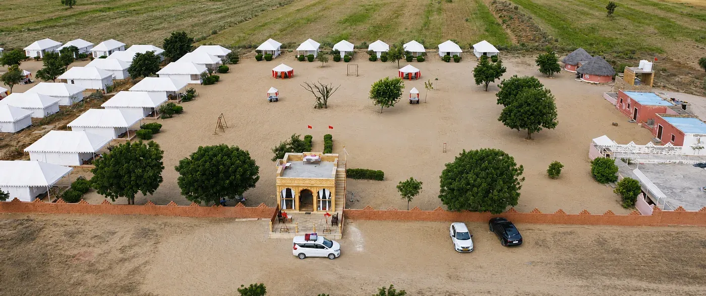 Aerial panoramic view of Sunny Desert Camp grounds, Swiss tents and mud cottages